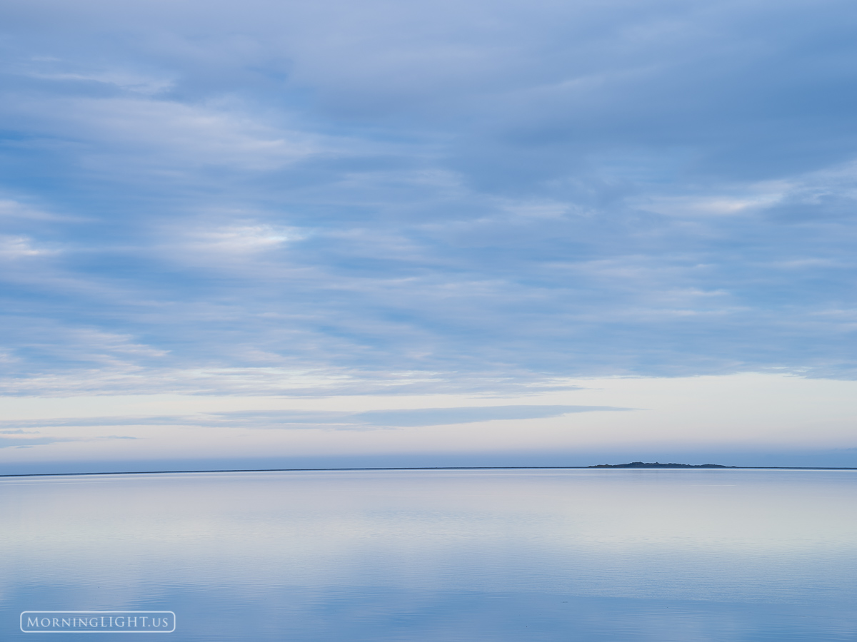 As I was driving down the eastern coast of Iceland, I found myself enchanted by the reflection of the sky in the water. About...